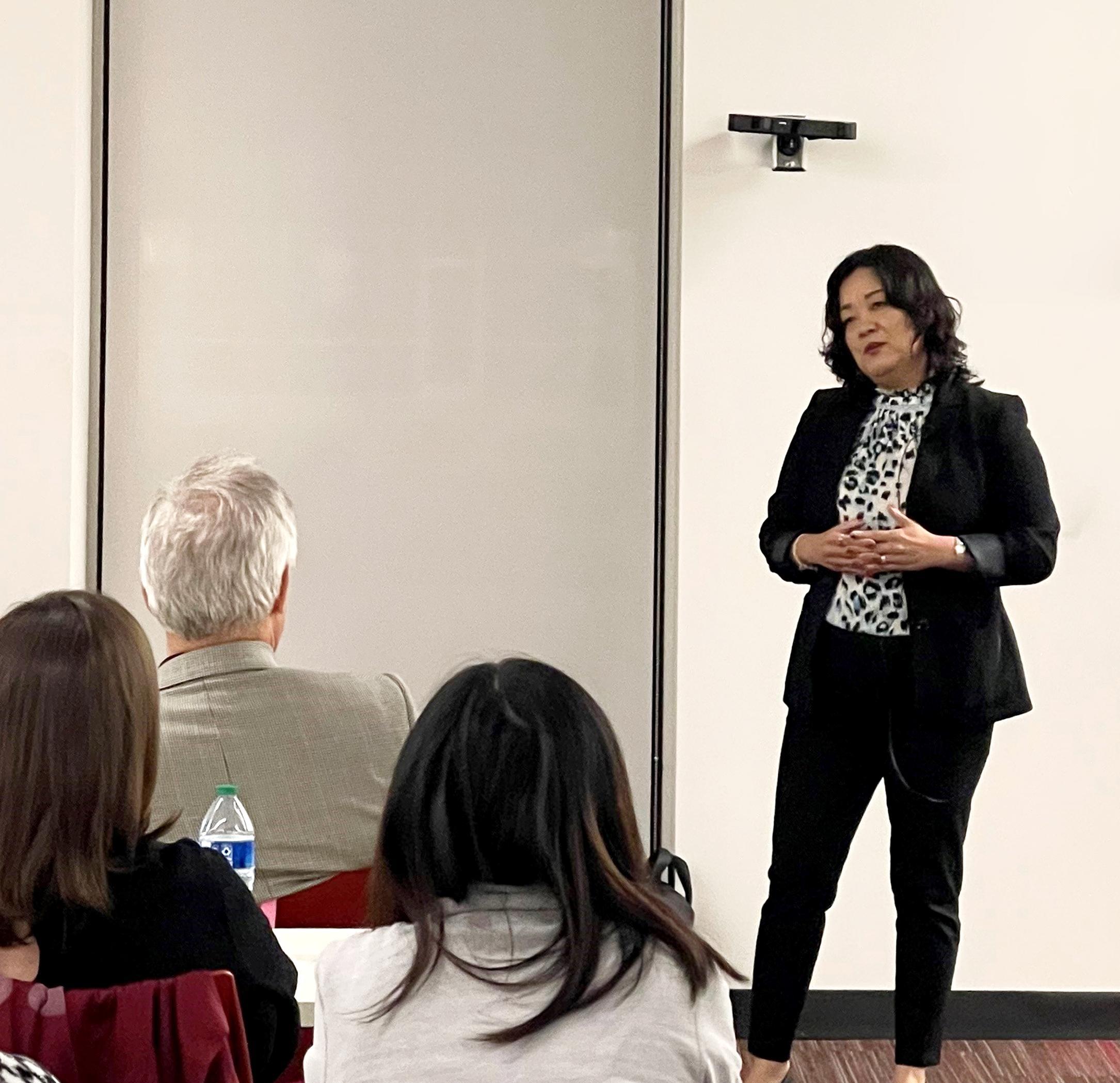 Huandong “Mary” Faris, Chief Financial Officer for Grocery Services Inc. and a UHV alumna, gives a presentation on Oct. 18 to a group of UHV alumni, faculty, staff and students as well as area community members at UHV Katy.