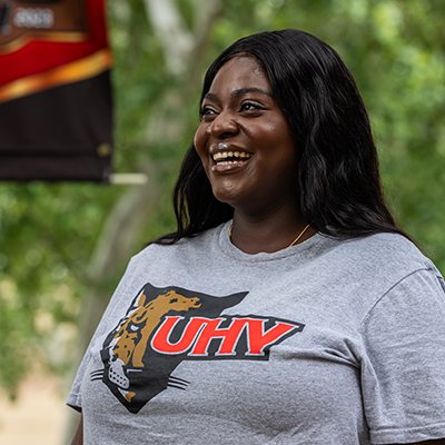 Student looking off camera and smiling