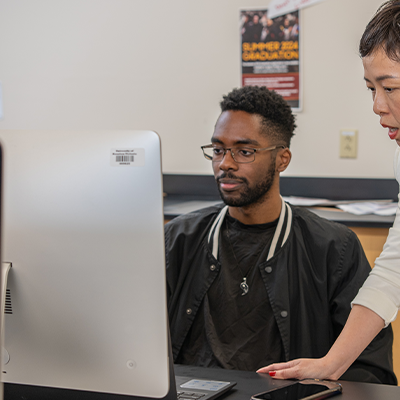 A student sitting in front of a computer screen
