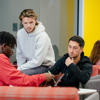 Three students sitting