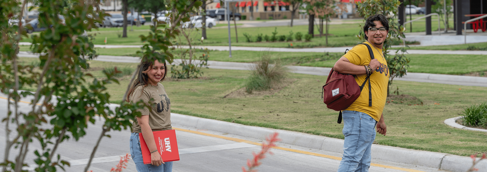 Two students crossing Ben Wilson Street by UHV Commons