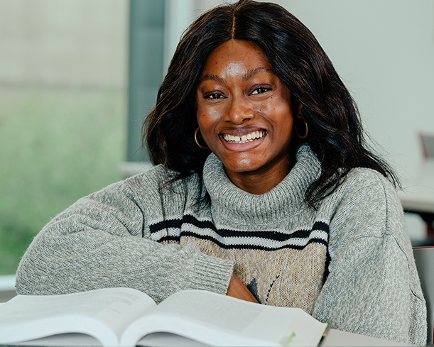 Smiling student with book