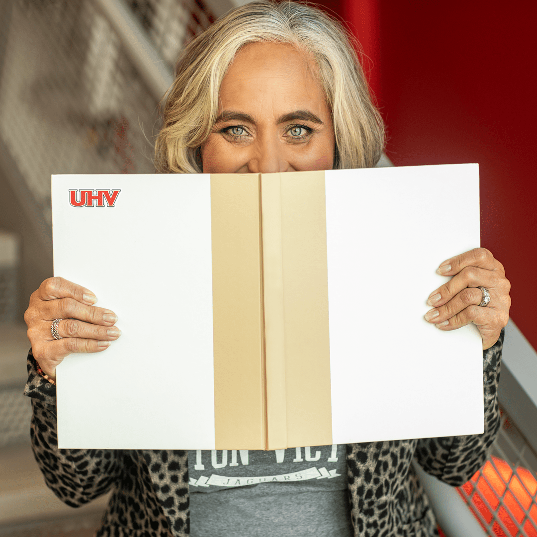 Jennifer Ortiz Graza holding a book