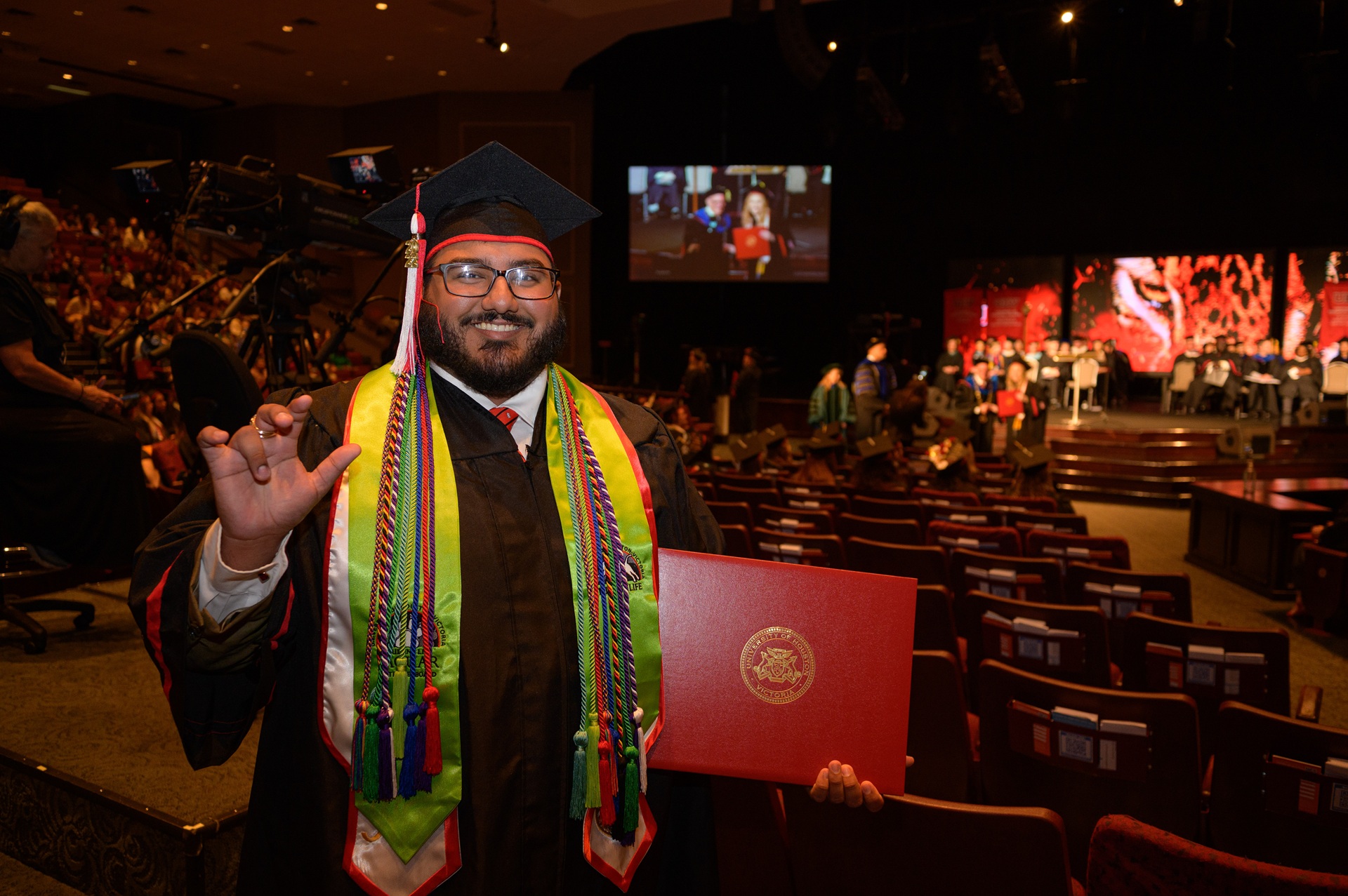 Male Graduate with Cords and sashes
