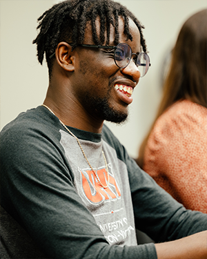 Student in UHV shirt listening in class