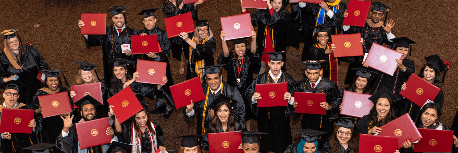 Students posing at graduation