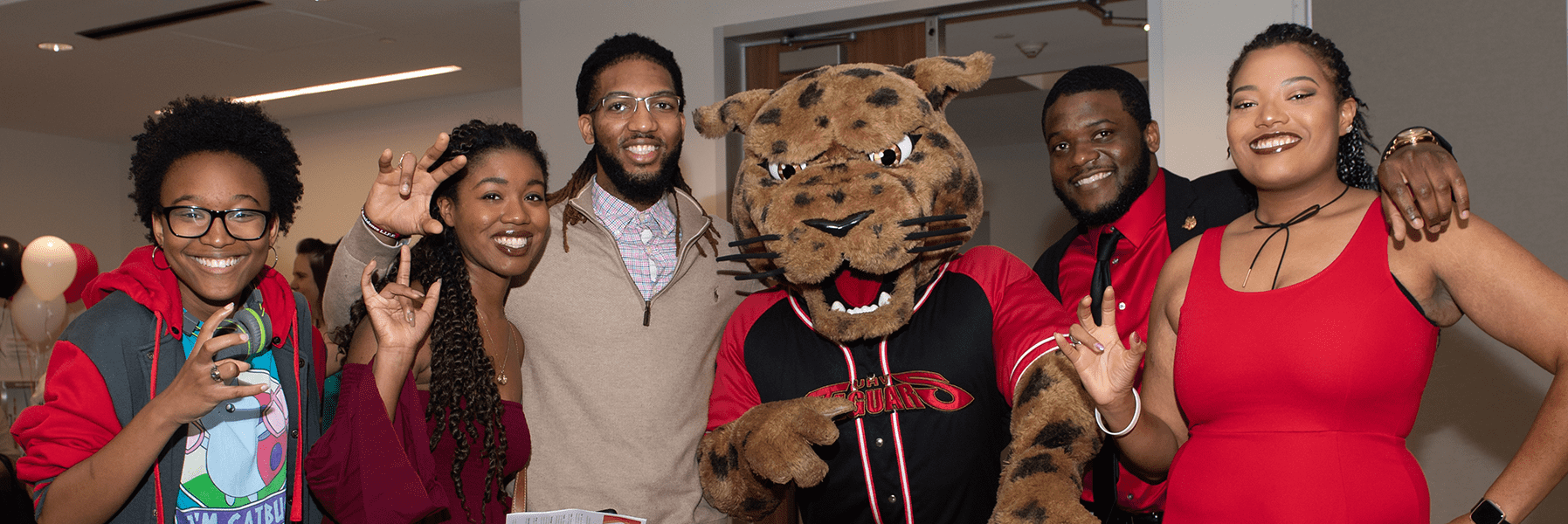 jaX posing with students