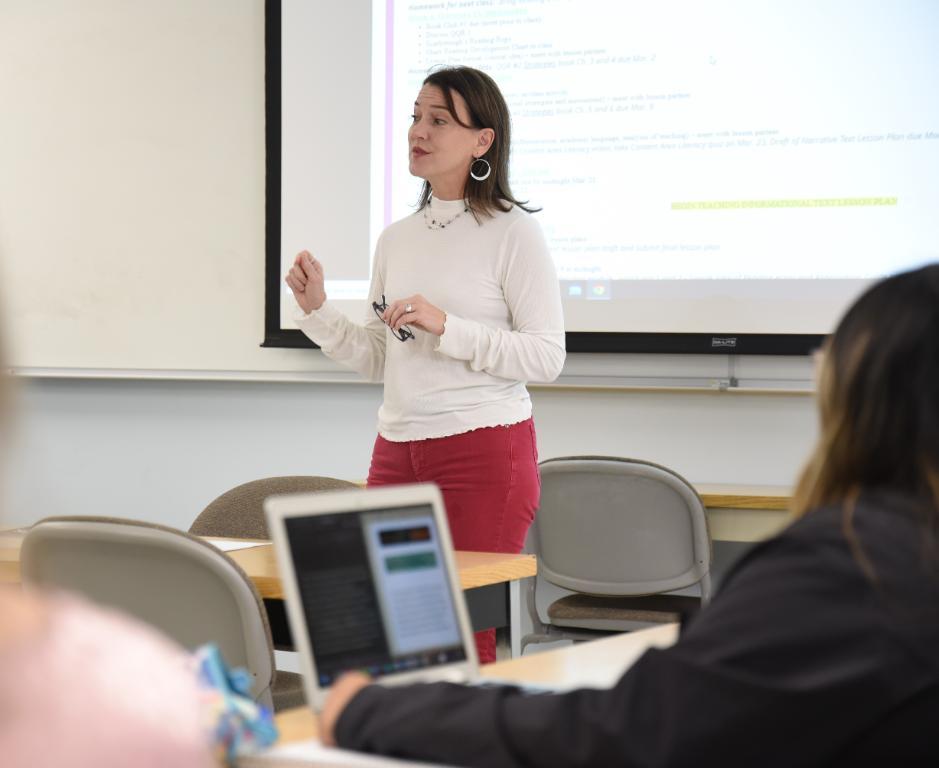 UHV faculty member teaching in front of a class