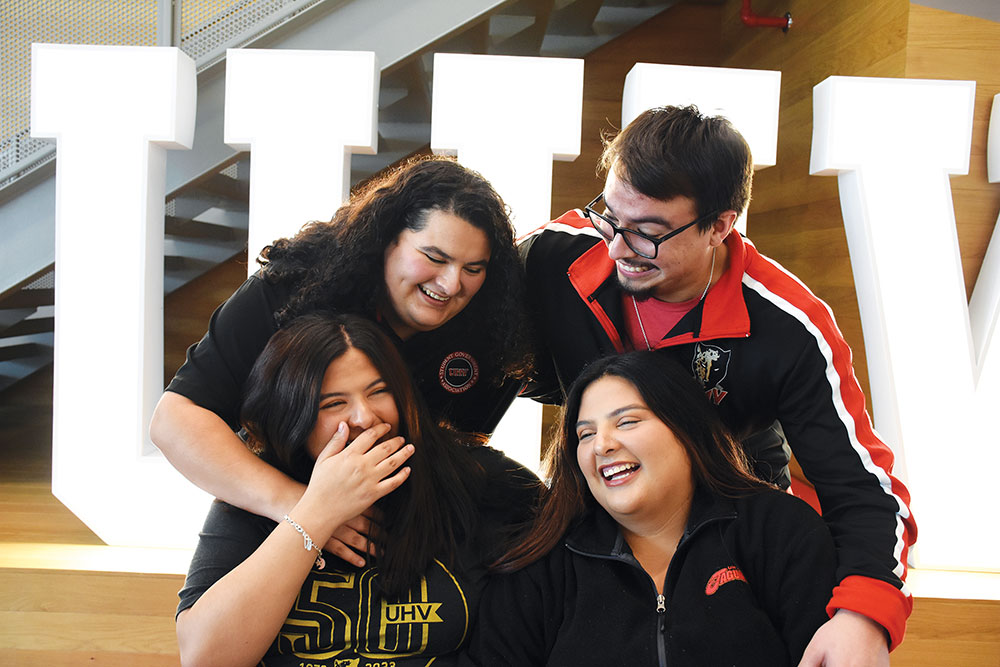 Four UHV sibling students pose together for a fun photo