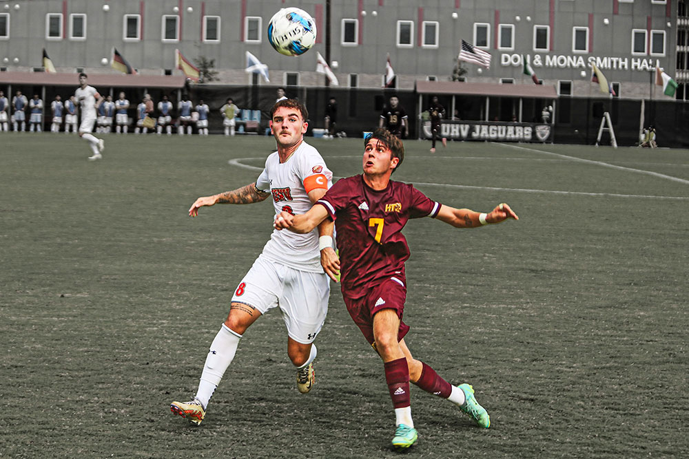 Adam Thompson on the field of play in a soccer game for UHV