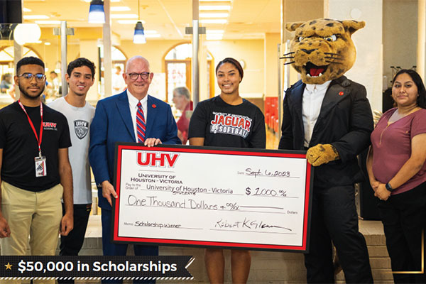 President Glenn poses for a photo with some of the winners of the UHV 50th anniversary scholarships
