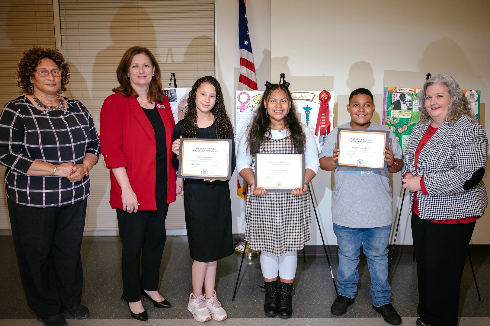 Winners of the 2023 Black History Month poster contest pose with their awards and their posters Tuesday at the University of Houston-Victoria after an award ceremony announcing the winners. Thirty-seven fifth-grade students from four elementary schools submitted posters featuring African American individuals following the theme, “Exploring Black Americans in STEM.” From left are Margie Montgomery,