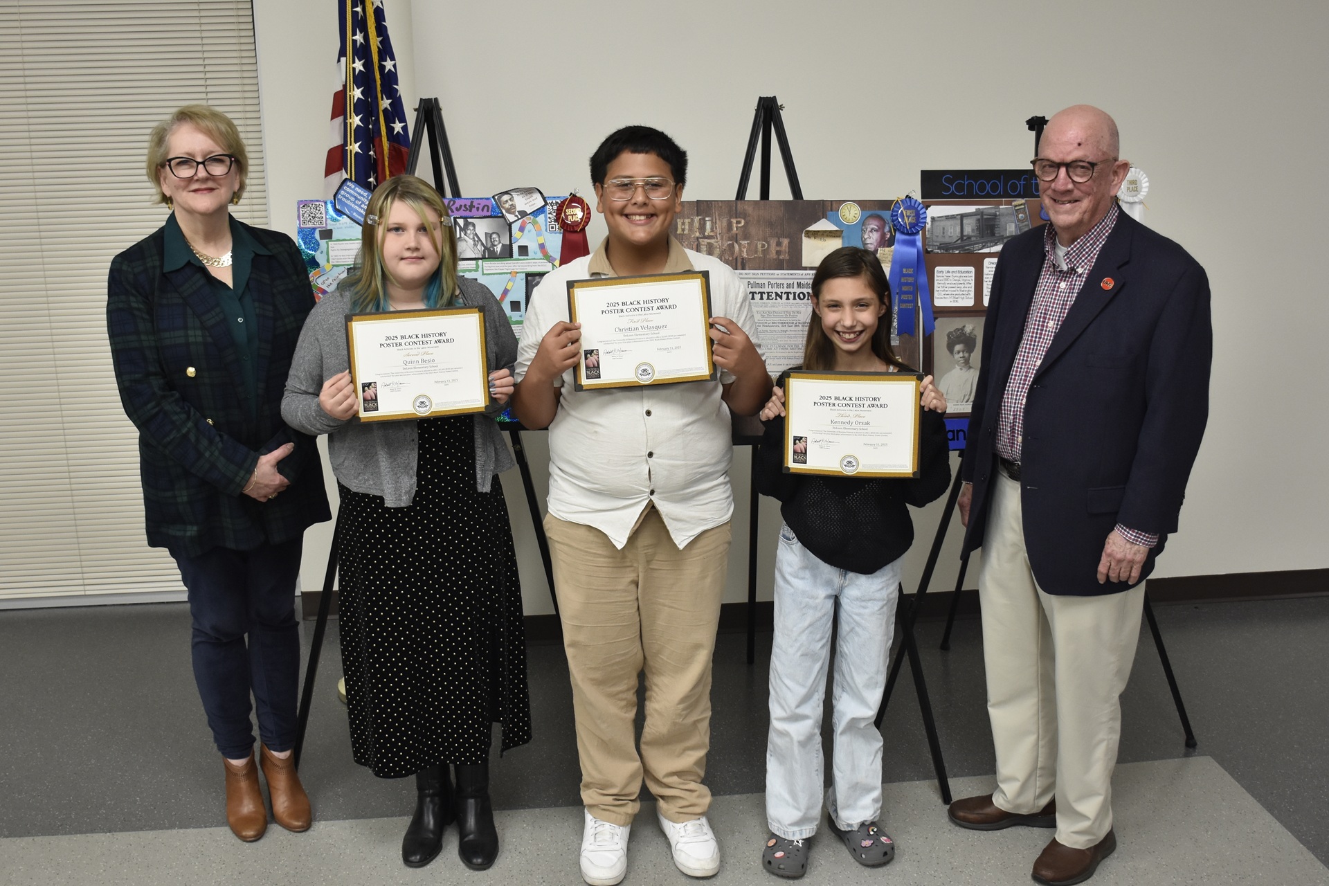 Three students hold up their certificates and stand with administrators from UHV and VC.