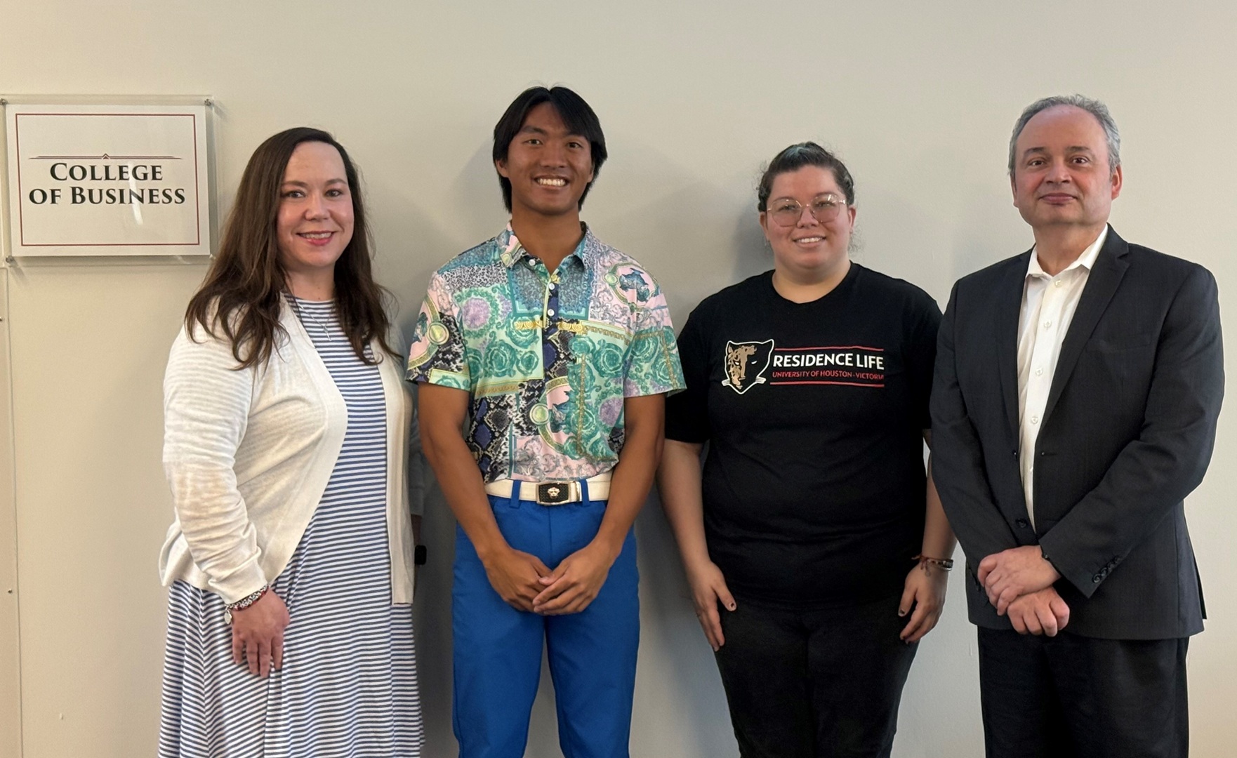 The scholarship recipients stand with UHV administrators. Pictured from left are Amber Countis, UHV vice president for advancement and external relations; Wutthichai “Lucky” Boonsrirat; Maria Carrillo Ortiz; and Xavier Garza-Gomez, interim dean of the UHV College of Business
