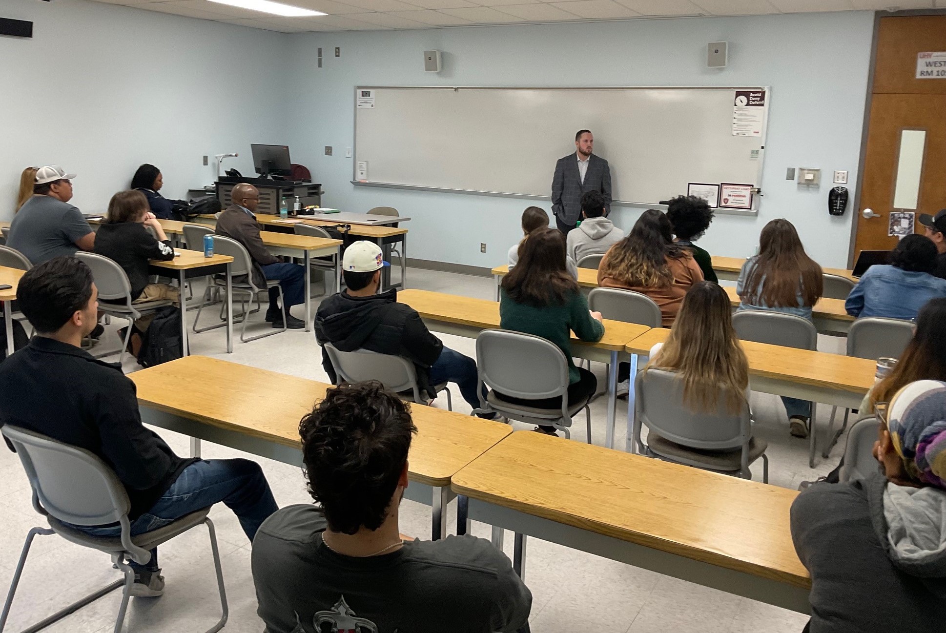 Ethan Myers talks to students in a classroom.