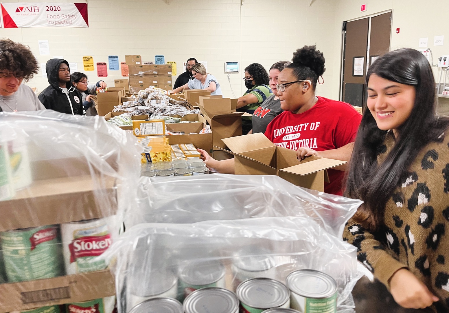 Navya Verma, far right, sorts through the donations with the help from other UHV students on Nov. 16, 2023, at the Food Bank of the Golden Crescent.