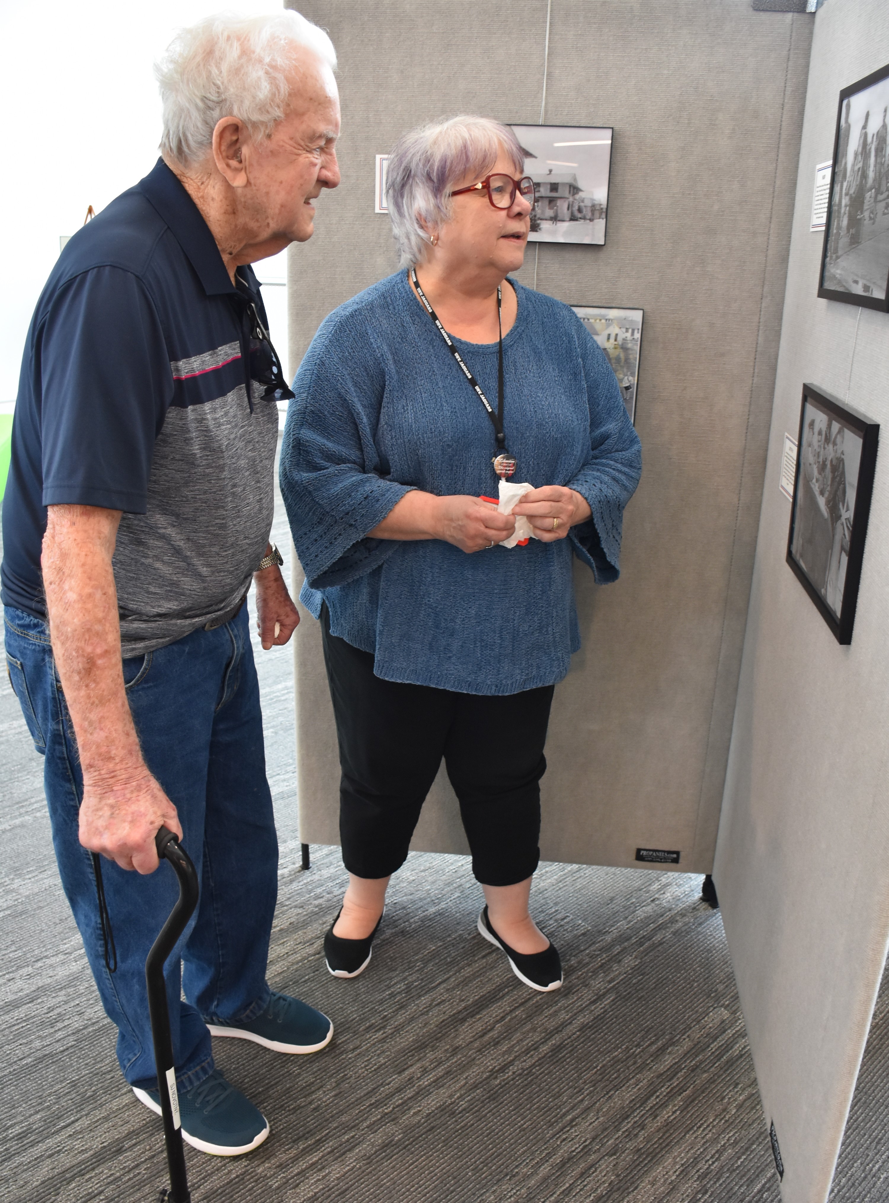 Steve Novotny, left, and his niece Karen Locher, UHV Library senior director, look at pictures in the “A Walk Through Foster Field” historical photograph exhibit Thursday.