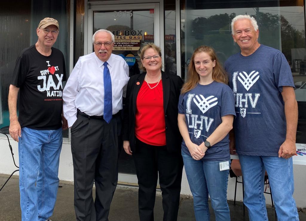 UHV staff and Gary Moses pose outside The Box Coffee Bar