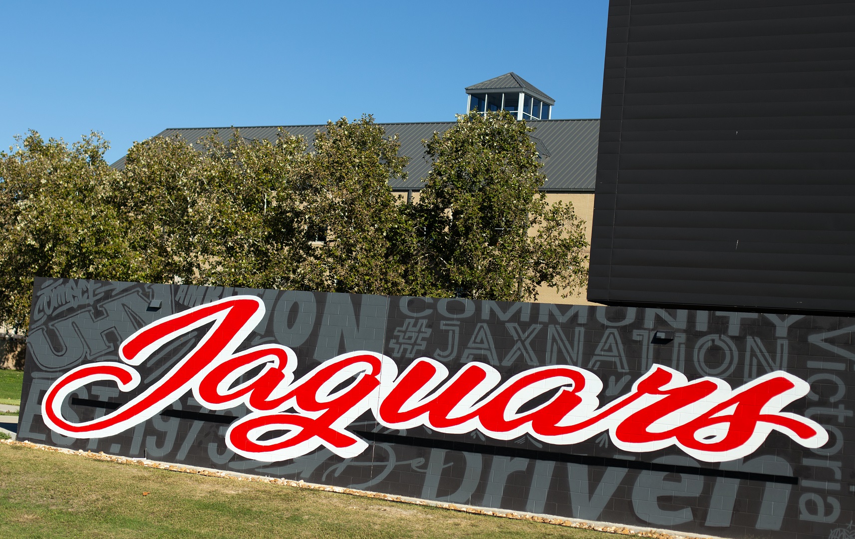 Large Jaguars mural adorns the side of UHV's University South building.