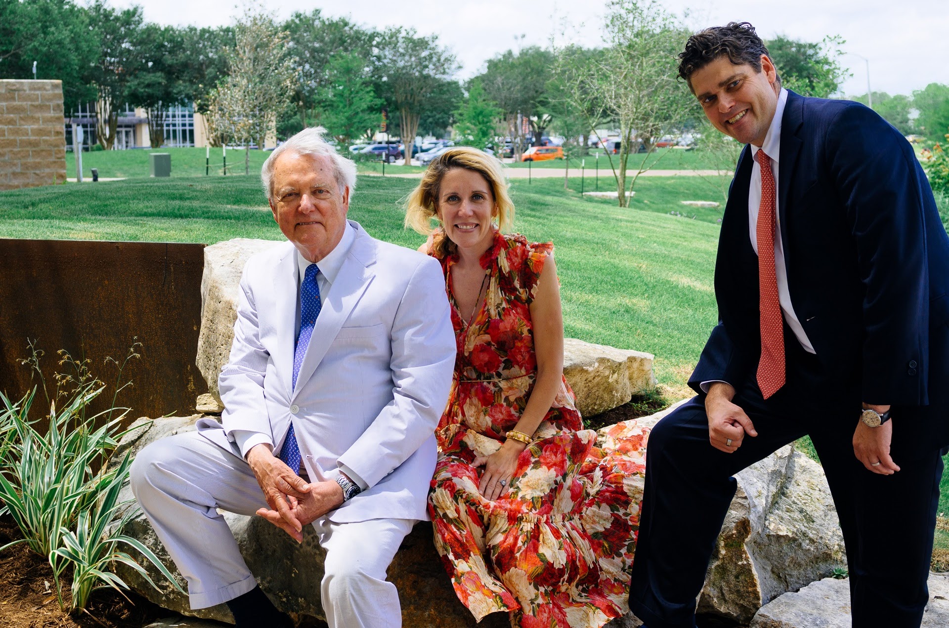 Ron Walker, left; Carter Walker-Dugan, center; and Bruce Walker pose together Tuesday at the opening of Kay’s Grove, a garden on UHV’s campus created in memory of Kay Kerr Walker.