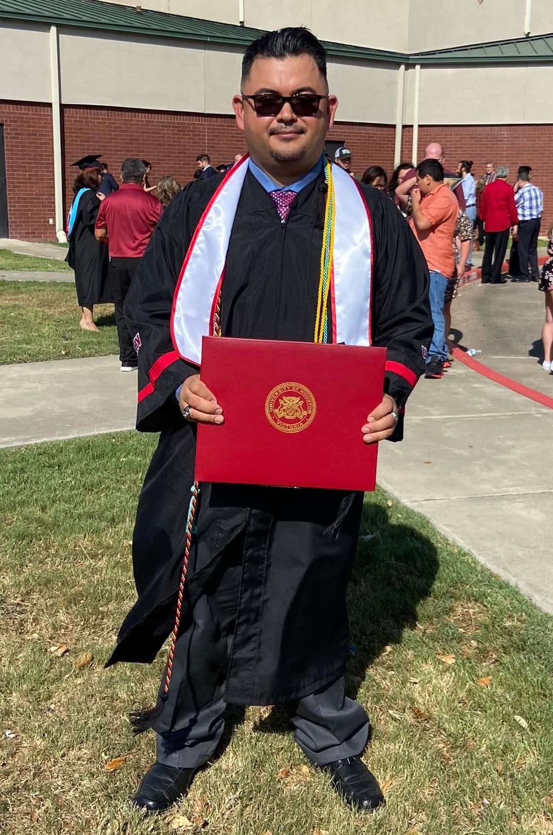 Ricardo Gonzalez holding his degree