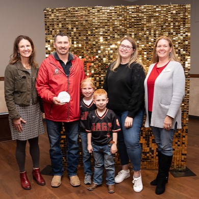 Members of Keep Victoria Beautiful present a representative from UHV with an award.
