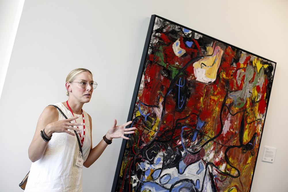 Cammie Tipton-Amini, assistant curator at Public Art University of Houston System, leads a group around UHV University South on Tuesday to see the various artwork in the building.