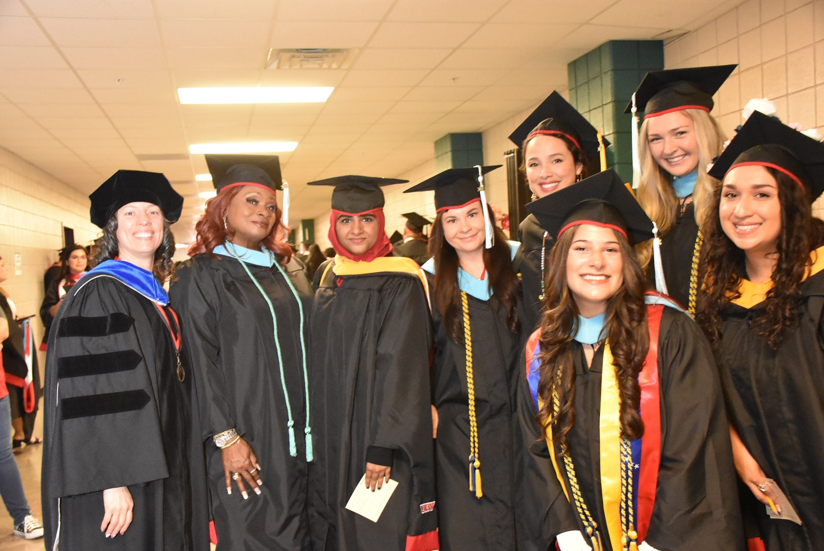 Photo of a group of UHV graduates in their caps and gowns at the 2022 commencement ceremony.