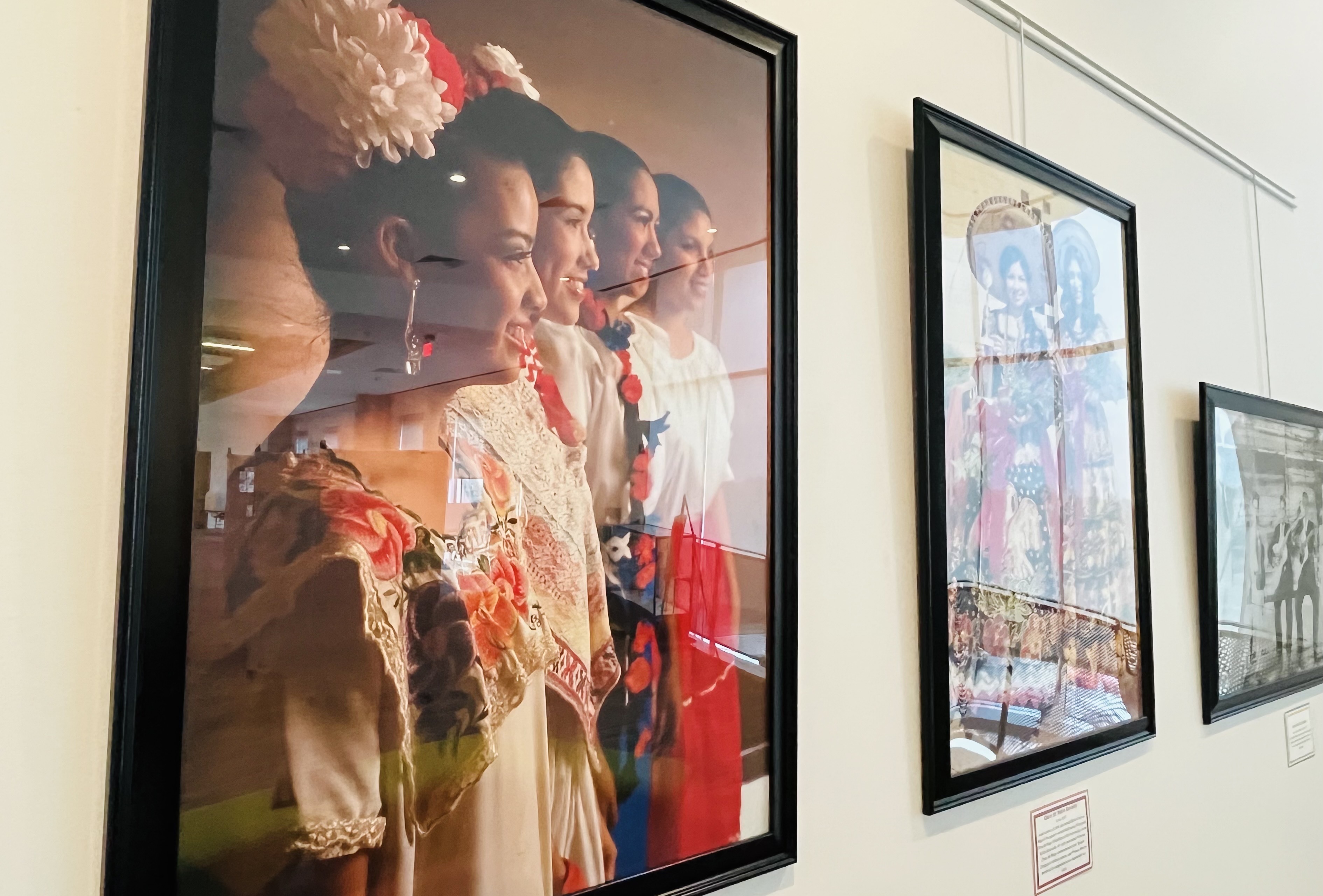 Pictures featuring images of Victoria's Hispanic heritage through the years hang in the UHV Library as part of the Celebrar las Raíces de Victoria photo exhibit.