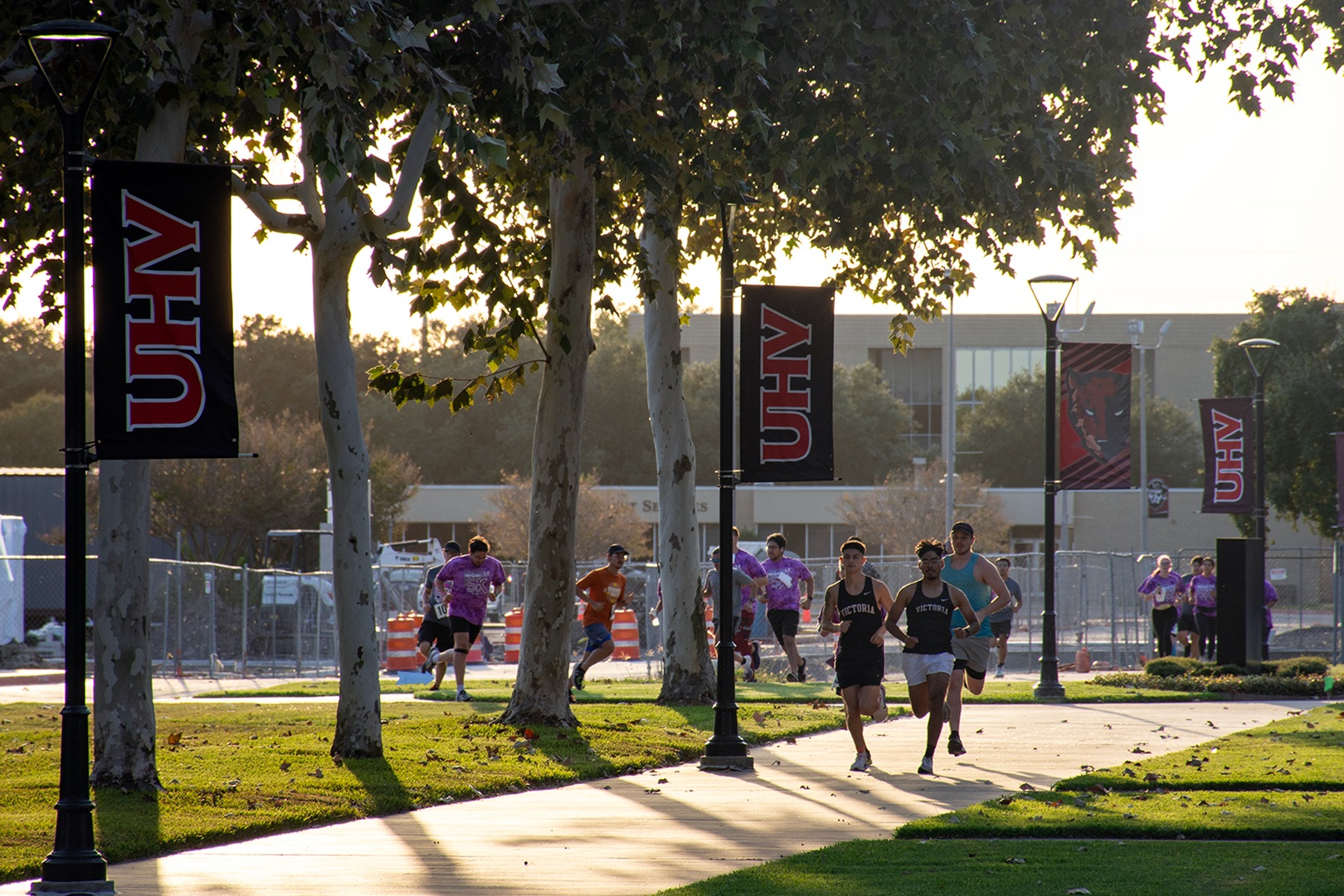 A group of people participating in the 2024 UHV/VC Glow 5K Run & Walk event