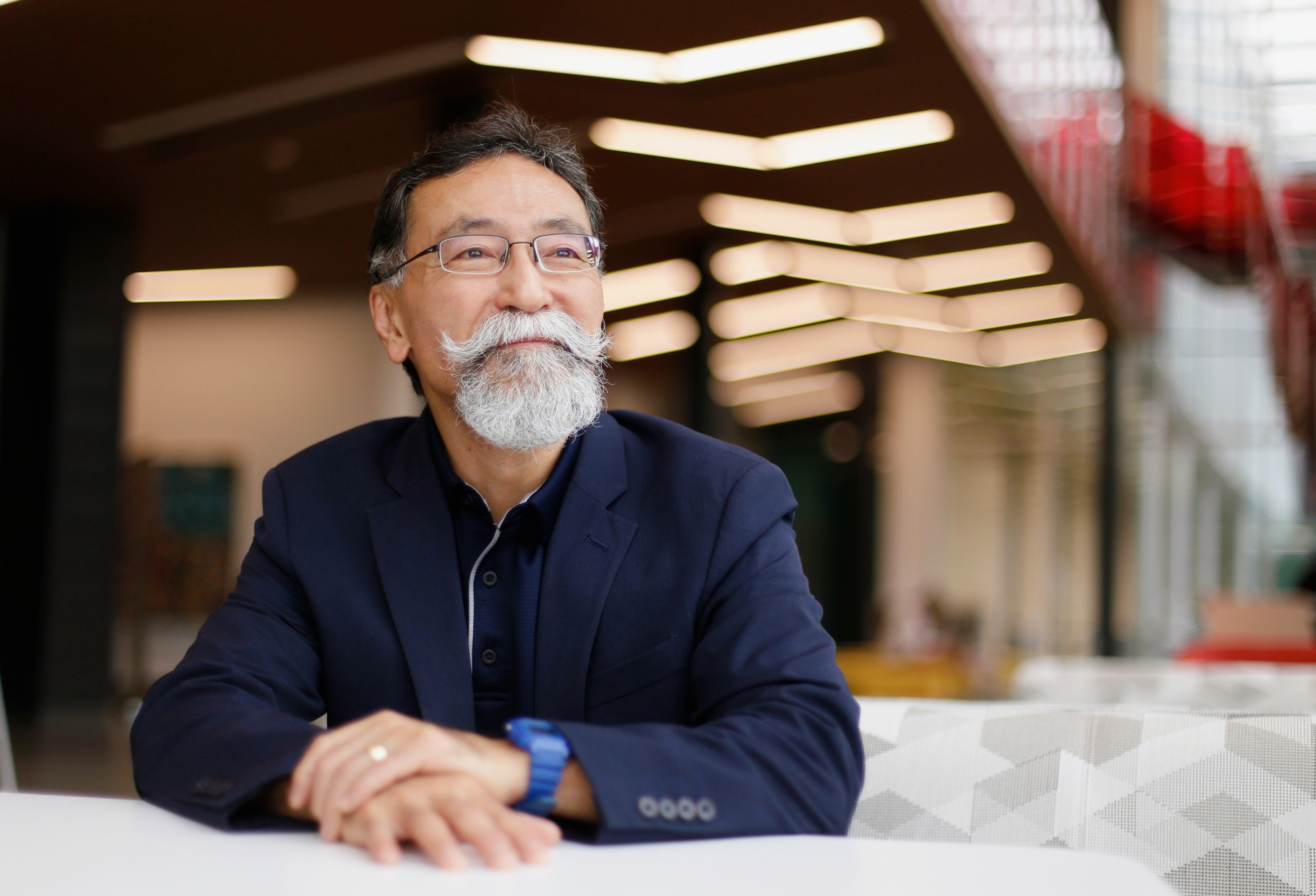 Dr. Yusuke Yahagi poses for a portrait inside University South. After serving as Victoria's cardiothoracic surgeon for over a decade, Dr. Yahagi is now enrolled at UHV to earn his teaching certification.